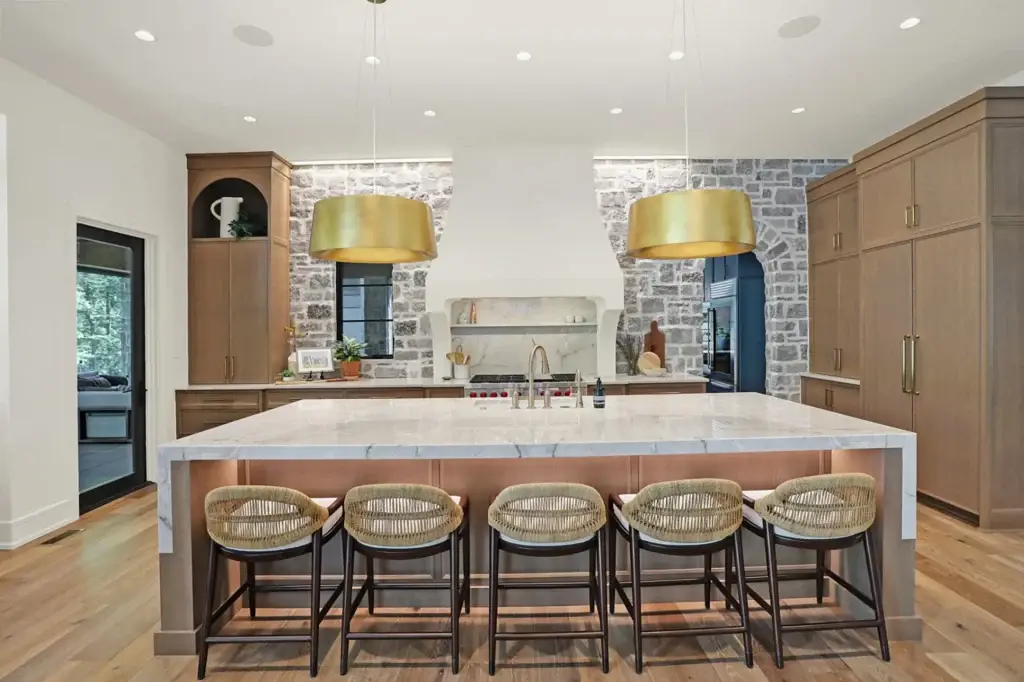 Technical view of slim shaker rift sawn white oak kitchen cabinets with architectural plaster hood and stone walls.