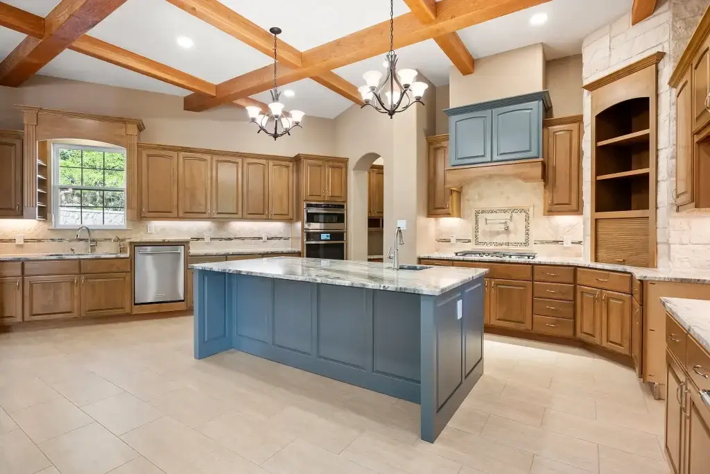 High-end honey oak cabinets kitchen installation with custom integrated paneling and soft-close storage.