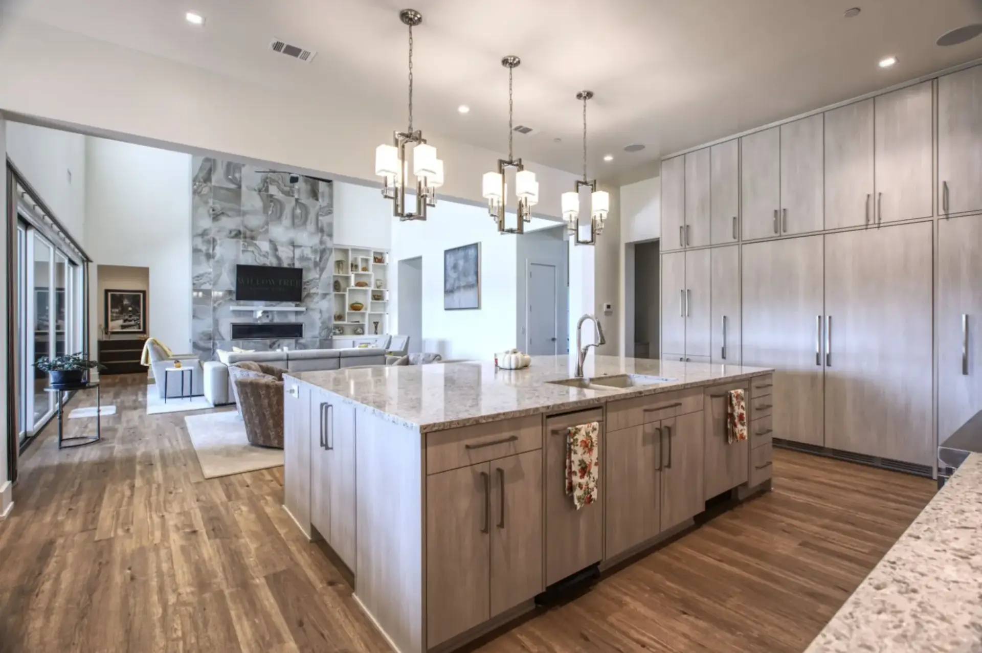 Open concept large kitchen island with integrated wine storage and solid plywood cabinet construction.