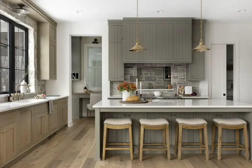 Elevation view focusing on custom sage green kitchen units surrounding a pro-grade slide-in range enclosed in a stacked stone alcove.