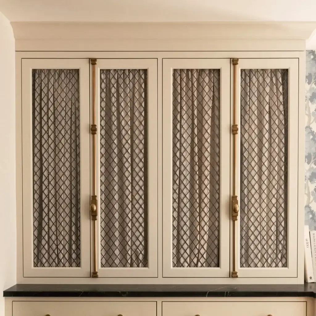 Bespoke custom doors for cabinets featuring geometric 3D chevron-milled walnut patterns and embedded brushed brass inlay details.