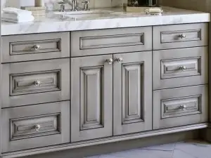 Custom painted and glazed raised panel cabinets with hand-wiped shadow highlights in moldings.