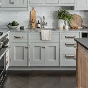 Custom cabinetry featuring recessed panel cabinet doors with a subtle chamfered inside bevel in a refined charcoal grey finish.