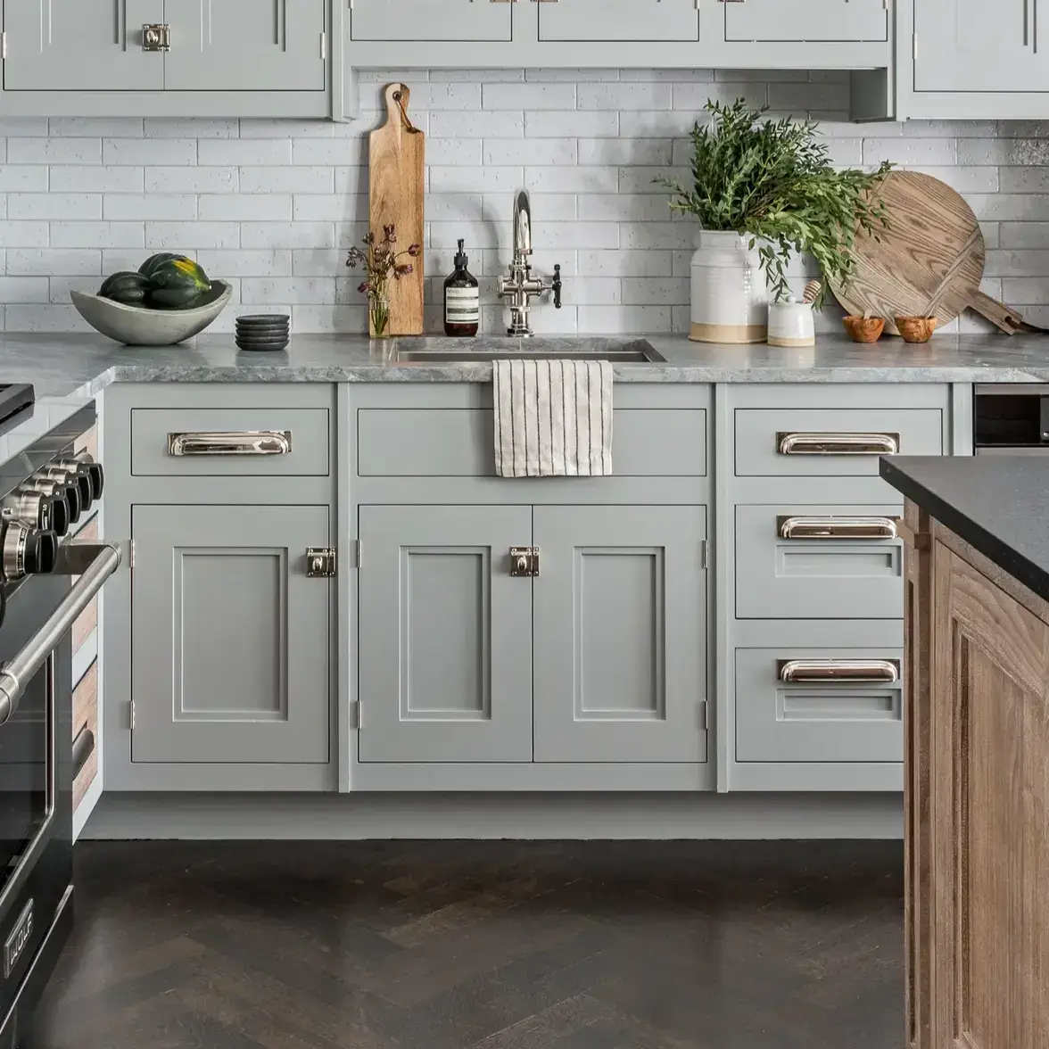 Custom cabinetry featuring recessed panel cabinet doors with a subtle chamfered inside bevel in a refined charcoal grey finish.