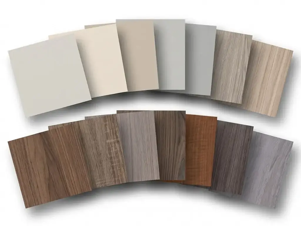 Textured melamine cabinet finish samples showing realistic wood grain and modern neutral solid colors for contemporary cabinetry.