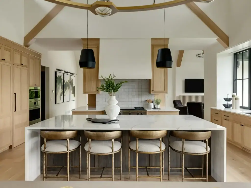 Front angle of island seating featuring scandinavian style kitchen cabinets with four curved counter stools.