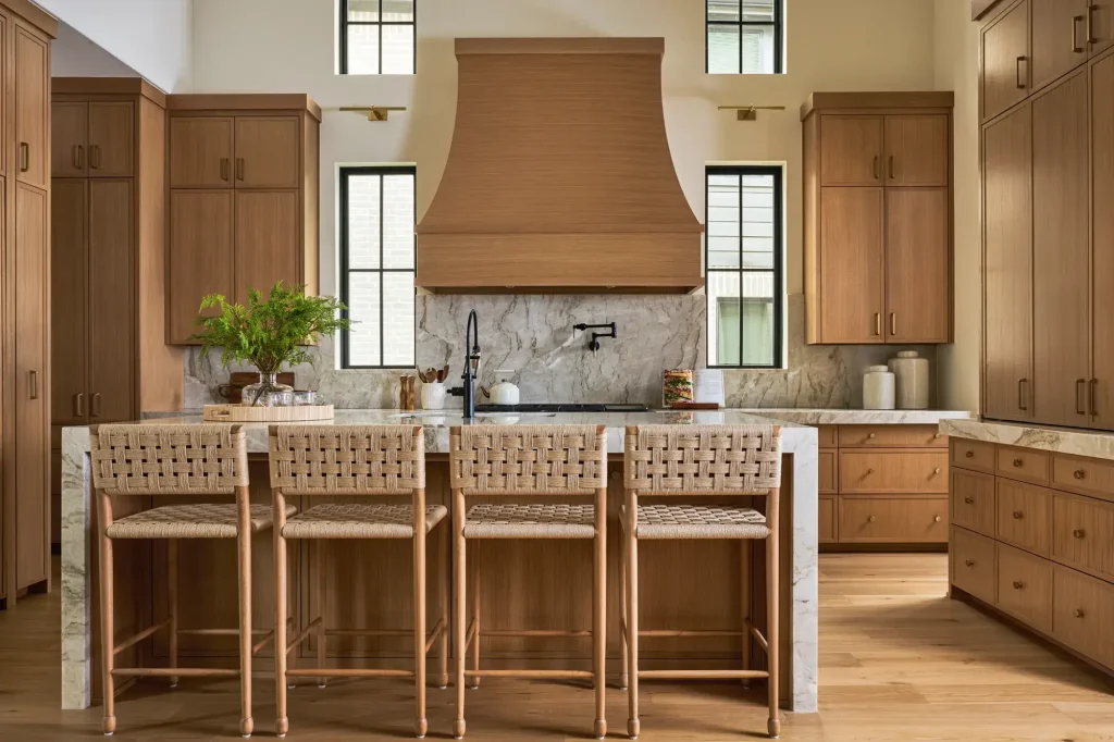 Front-facing center elevation of slim shaker white oak kitchen cabinets centered on curved hood and clerestory windows.