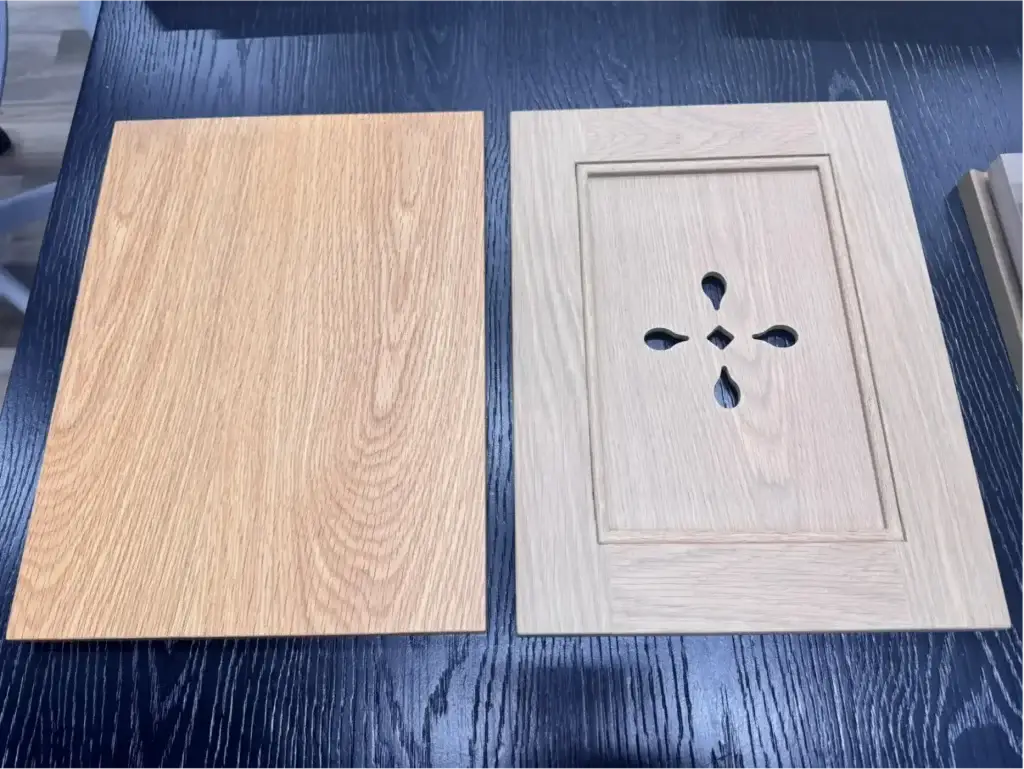 Architectural veneer vs solid wood cabinets comparing modern flat slab door and 5-piece shaker frame samples