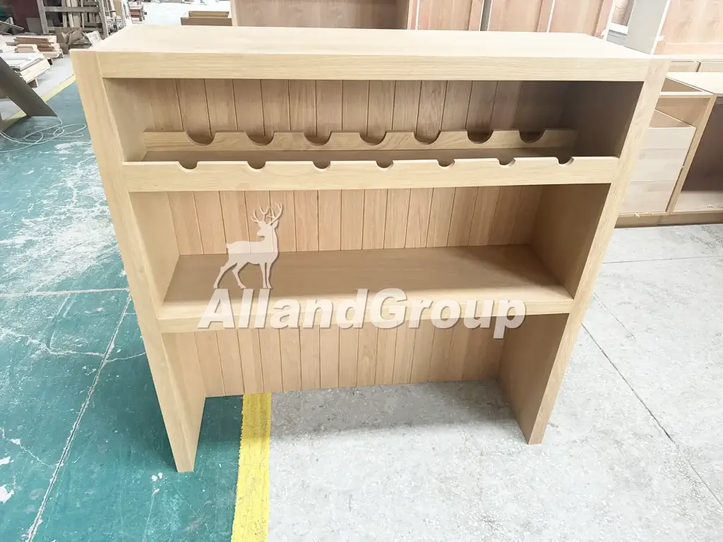 Custom built-in solid white oak wine rack unit with vertical fluted back panel