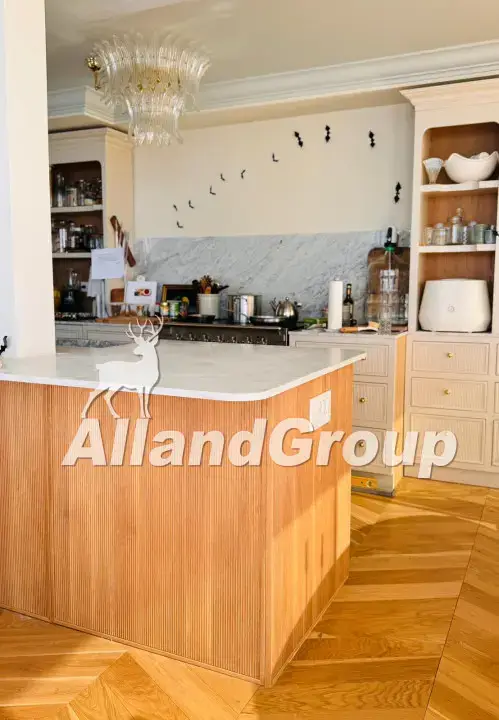 Fluted white oak cabinets and curved wood slat island in San Diego custom kitchen