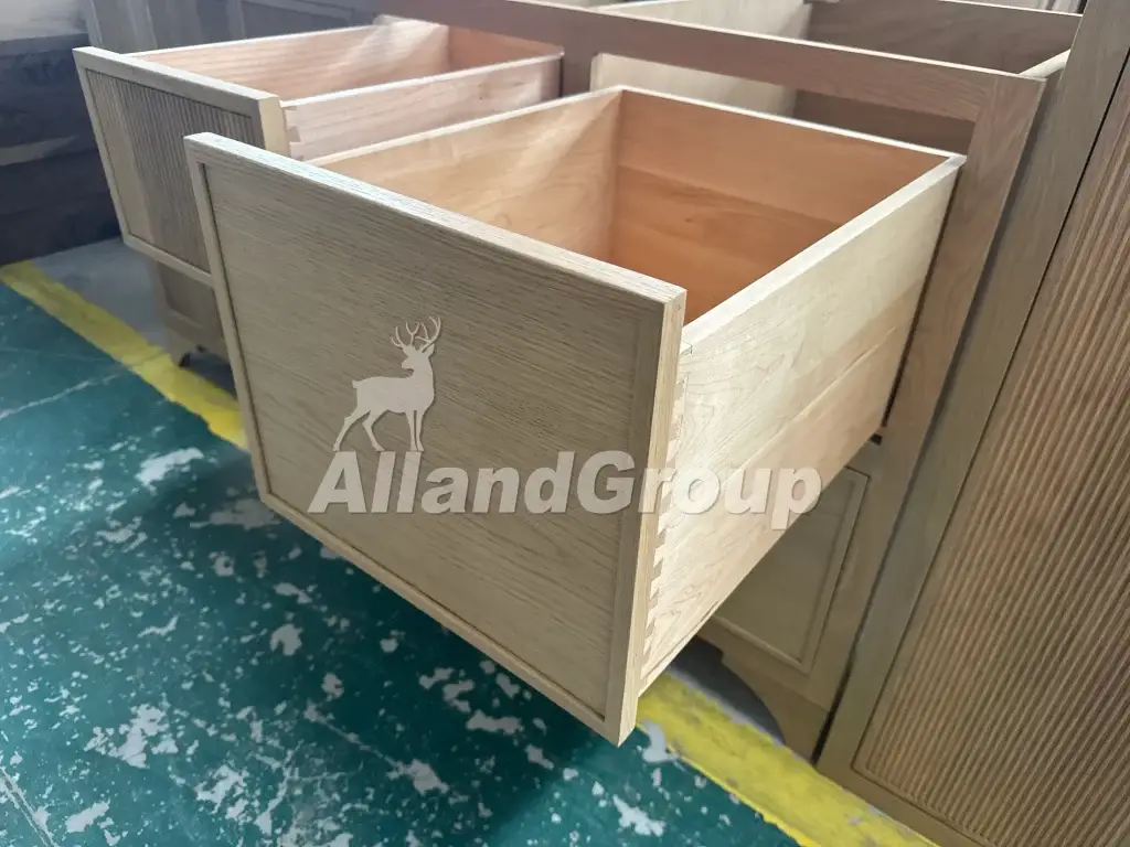 English solid wood dovetail drawer box joinery in fluted white oak cabinets