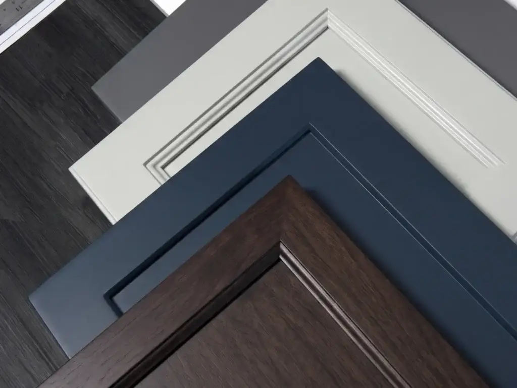White flat, Dark Gray flat, Light Gray with inset moulding, Navy Blue Shaker, and Dark Brown Stained wood.