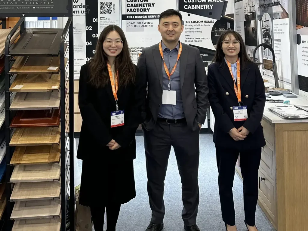 ALLAND in-house technical drafting and cabinet design process team showcasing custom millwork samples and engineering support at international building trade show