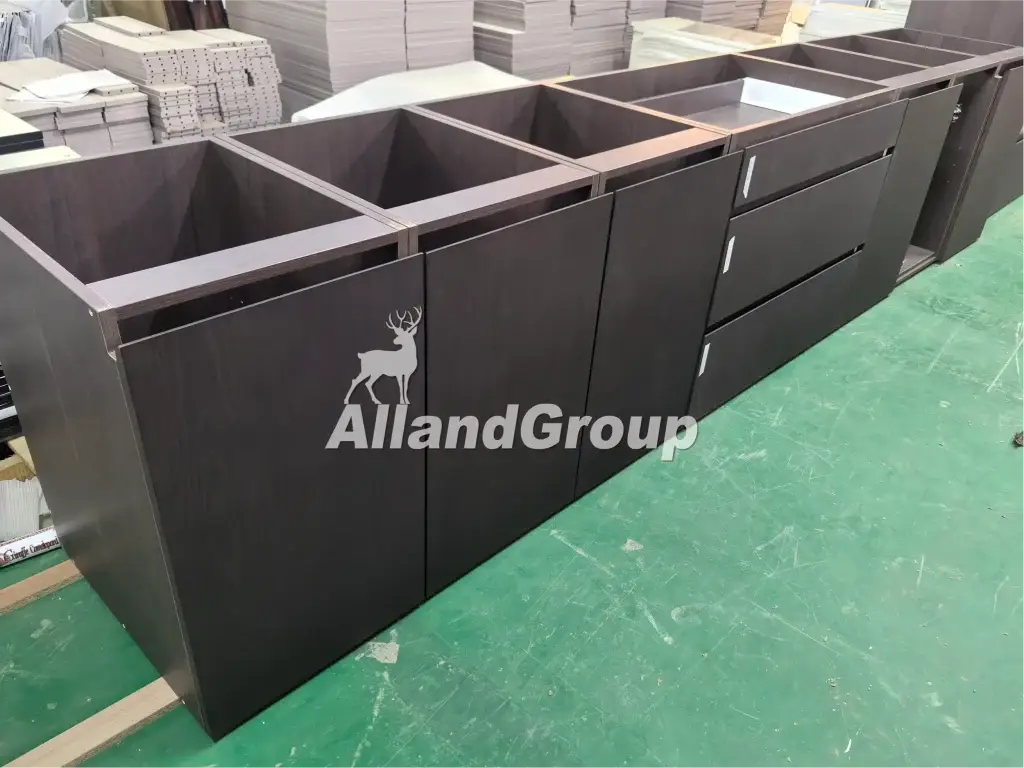 Factory inspection of dark wood veneer kitchen cabinet drawers and plywood carcass structure
